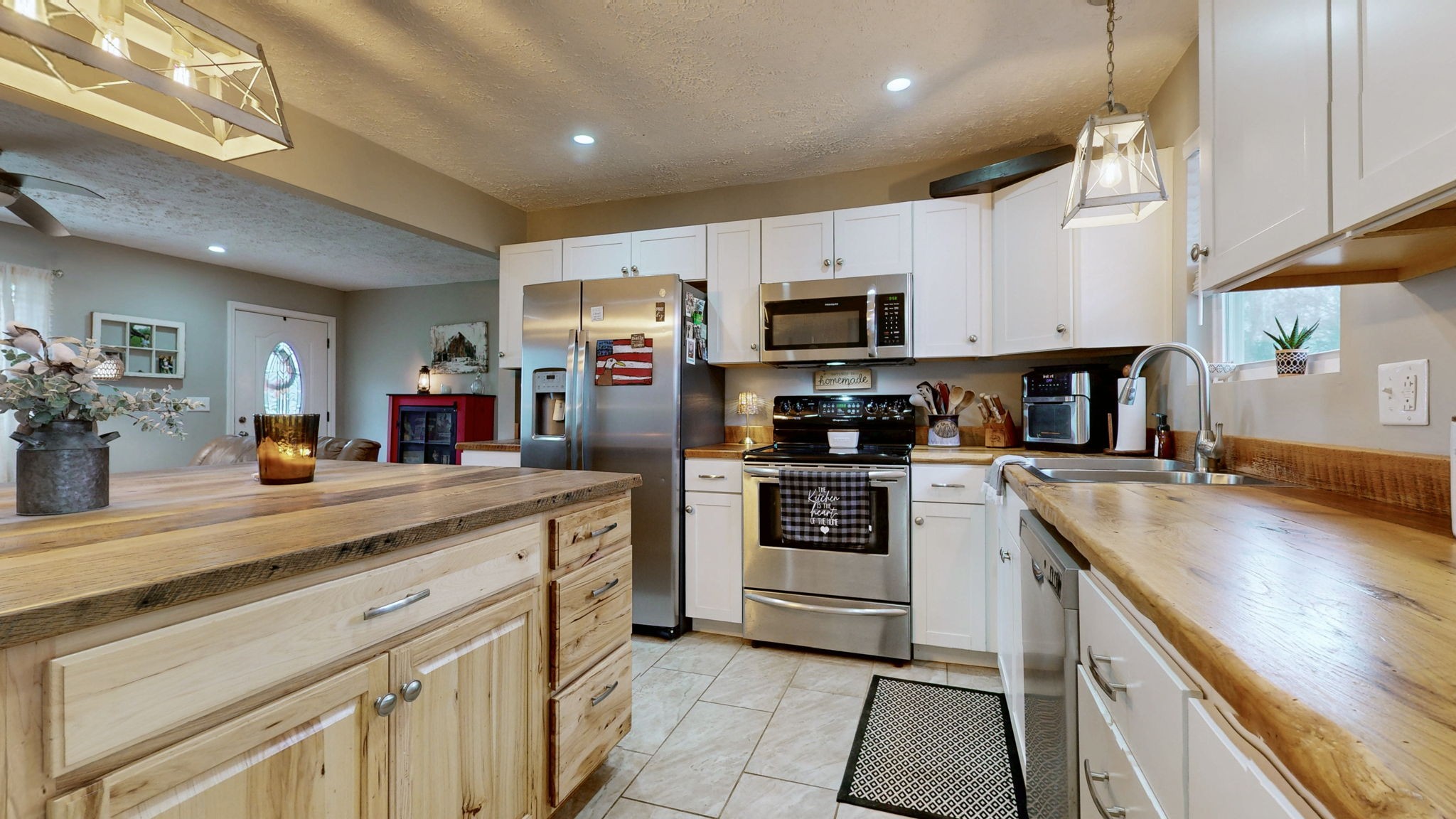 3182 Cairo Bend Road Lebanon, TN 37087 - Photo 14 of 51 a kitchen with kitchen island granite countertop stainless steel appliances cabinets a sink and a counter top space