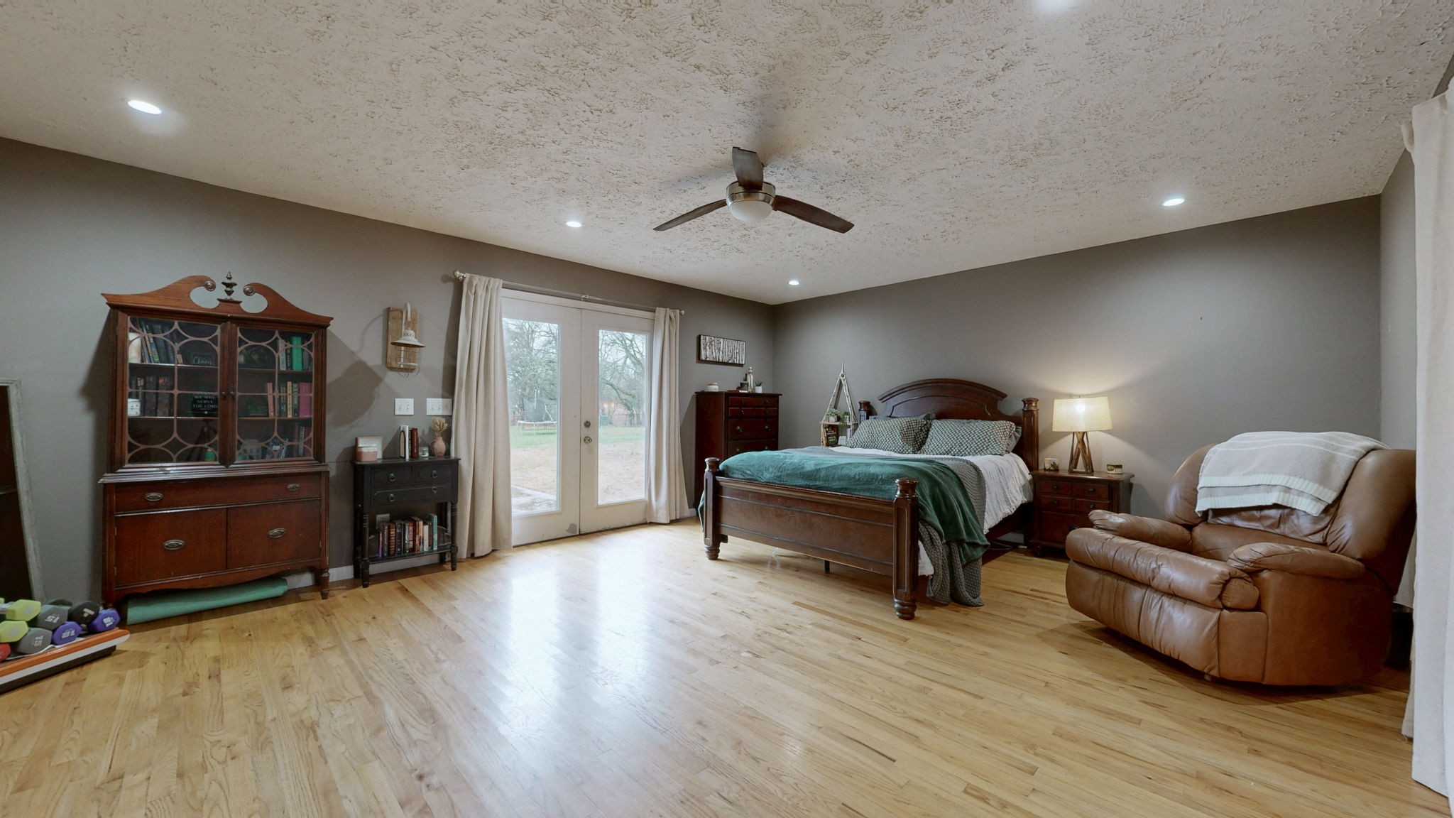 3182 Cairo Bend Road Lebanon, TN 37087 - Photo 16 of 51 a bedroom with a bed and wooden floor