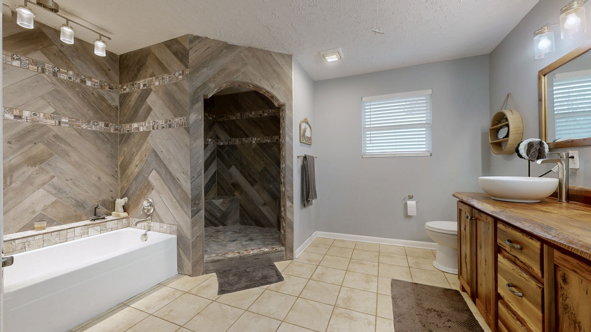 3182 Cairo Bend Road Lebanon, TN 37087 - Photo 19 of 51 a bathroom with a granite countertop sink a toilet and bathtub
