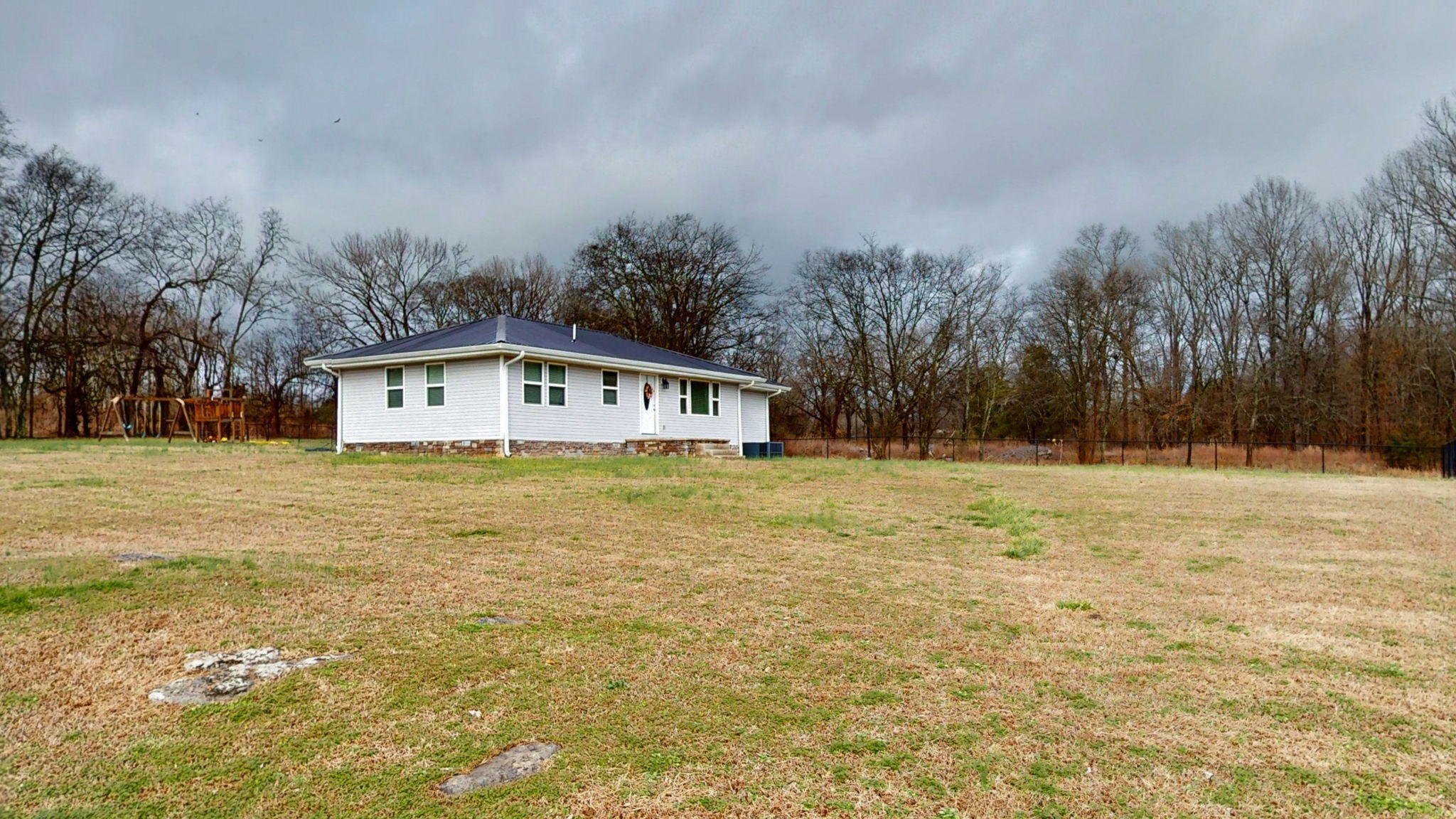 3182 Cairo Bend Road Lebanon, TN 37087 - Photo 5 of 51 a front view of house with yard and trees in the background
