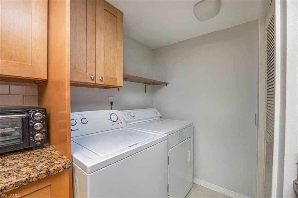 3635 Boca Ciega Drive, Unit 207 Naples, FL 34112 - Photo 16 of 24 a utility room with dryer and washer