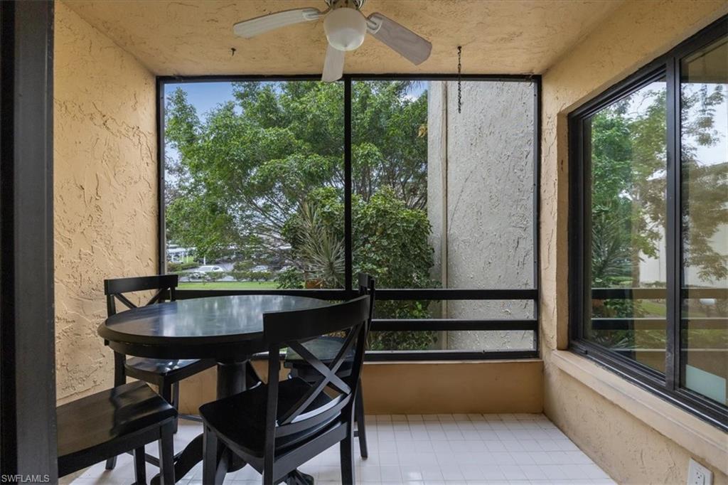 3635 Boca Ciega Drive, Unit 207 Naples, FL 34112 - Photo 17 of 24 a view of a dining room with furniture window and outside view