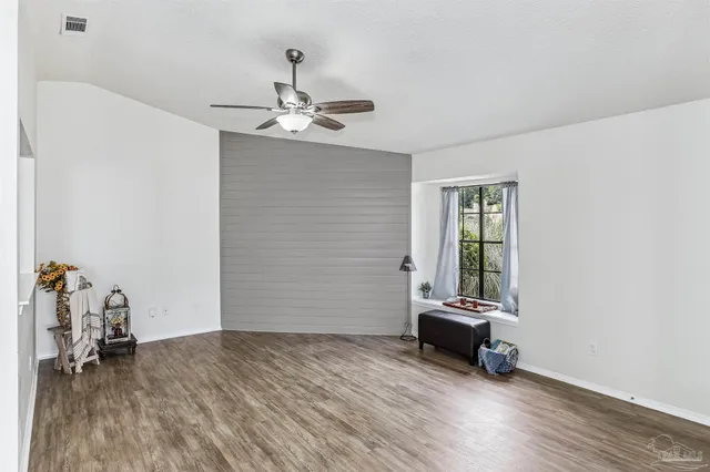 a view of a livingroom with wooden floor