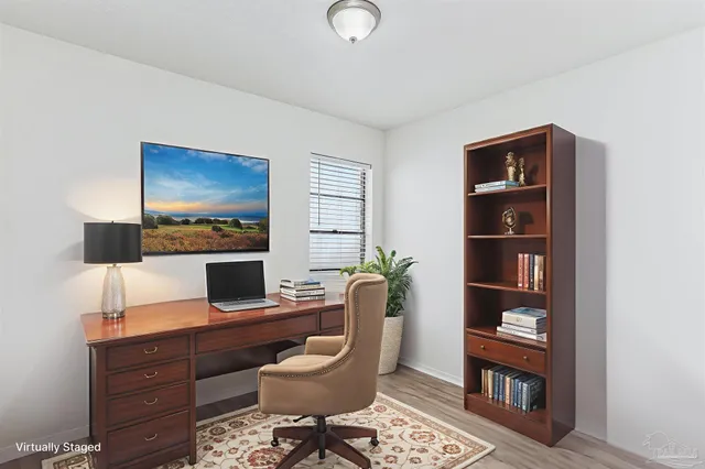 a view of a workspace with furniture