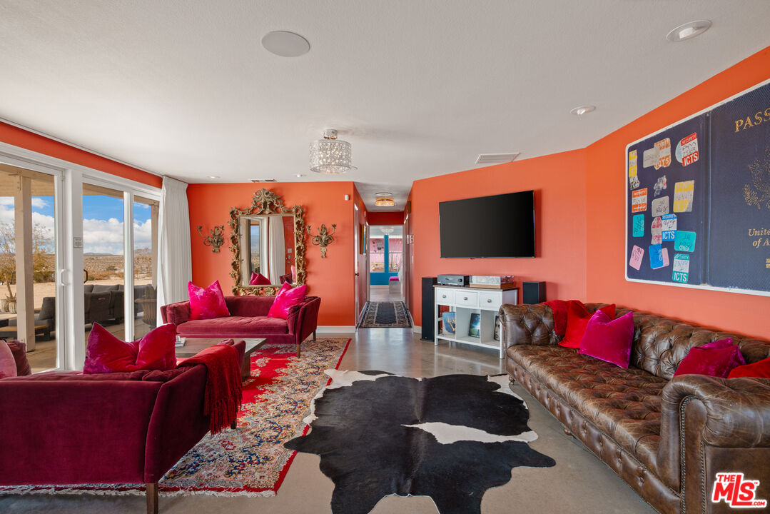 64425 Carot Road Joshua Tree, CA 92252 - Photo 17 of 73 a living room with furniture fireplace and flat screen tv