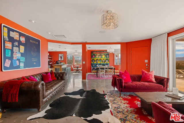 a view of a dining room with furniture and window