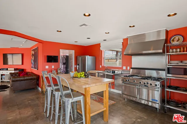 a kitchen with sink and cabinets