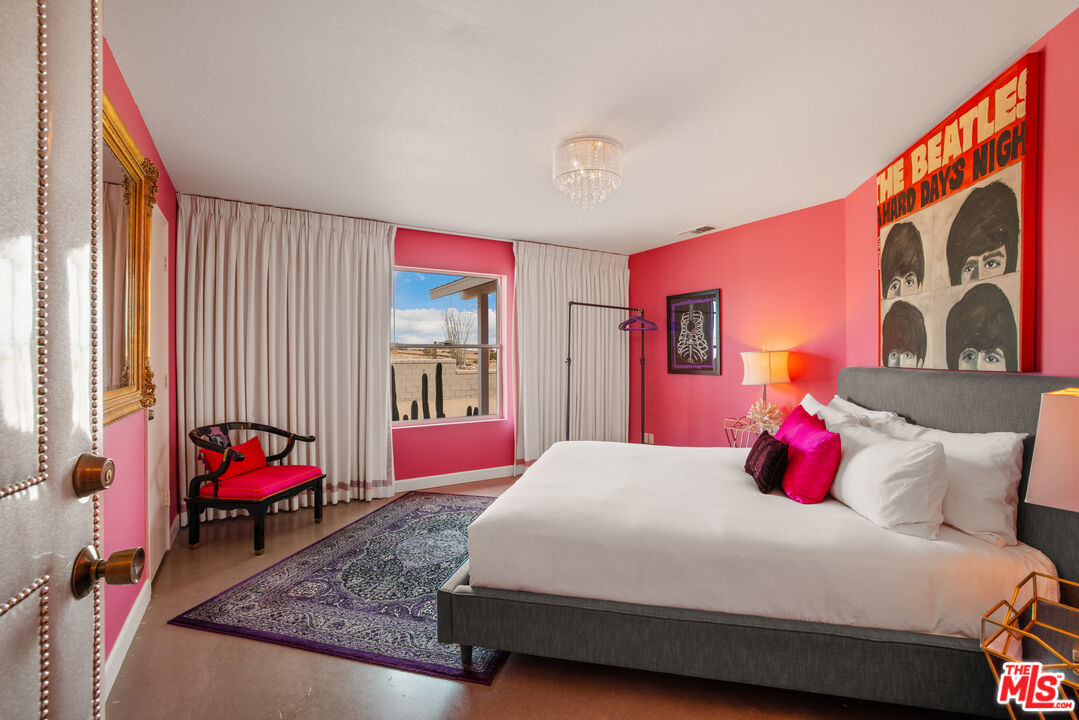 64425 Carot Road Joshua Tree, CA 92252 - Photo 27 of 73 a bedroom with a bed and window