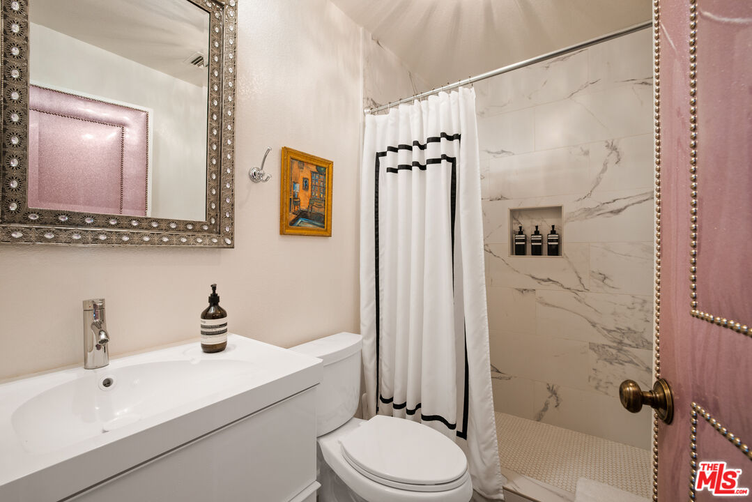 64425 Carot Road Joshua Tree, CA 92252 - Photo 28 of 73 a bathroom with a sink toilet and shower