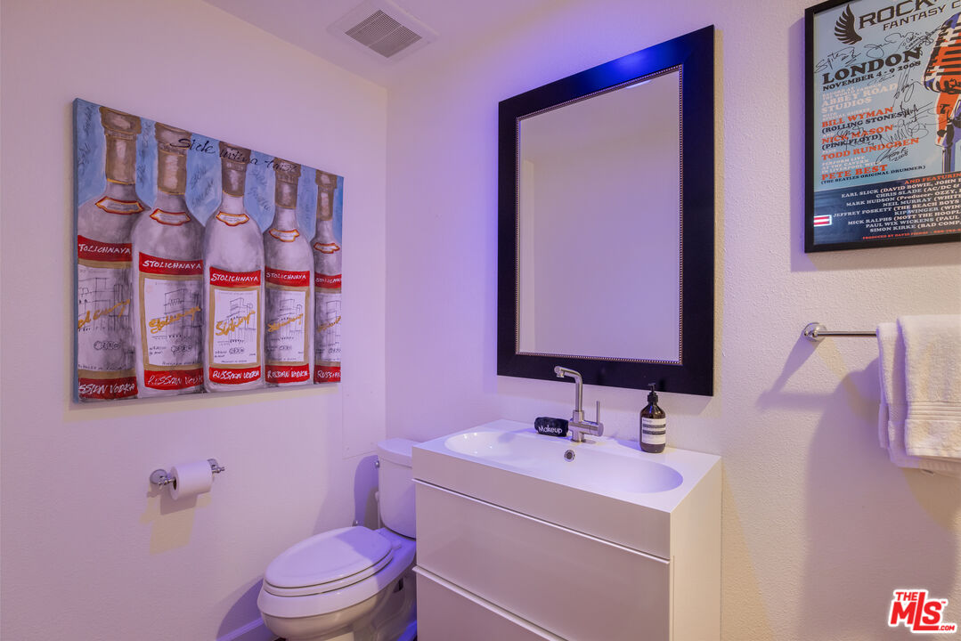 64425 Carot Road Joshua Tree, CA 92252 - Photo 45 of 73 a bathroom with a sink mirror vanity and toilet