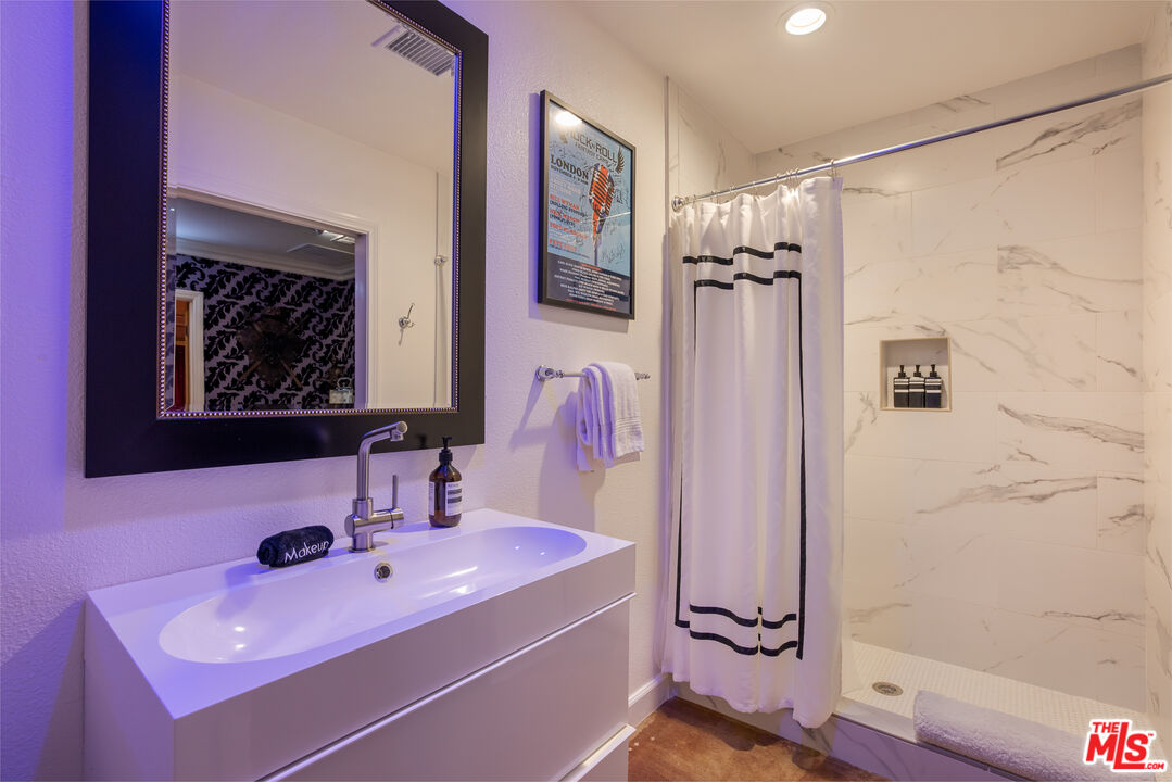 64425 Carot Road Joshua Tree, CA 92252 - Photo 46 of 73 a bathroom with a sink mirror and a shower