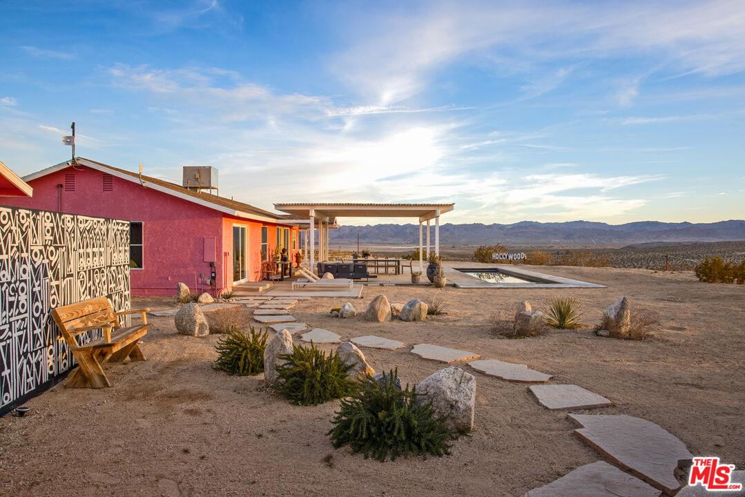 64425 Carot Road Joshua Tree, CA 92252 - Photo 51 of 73 a view of a house with backyard and sitting area