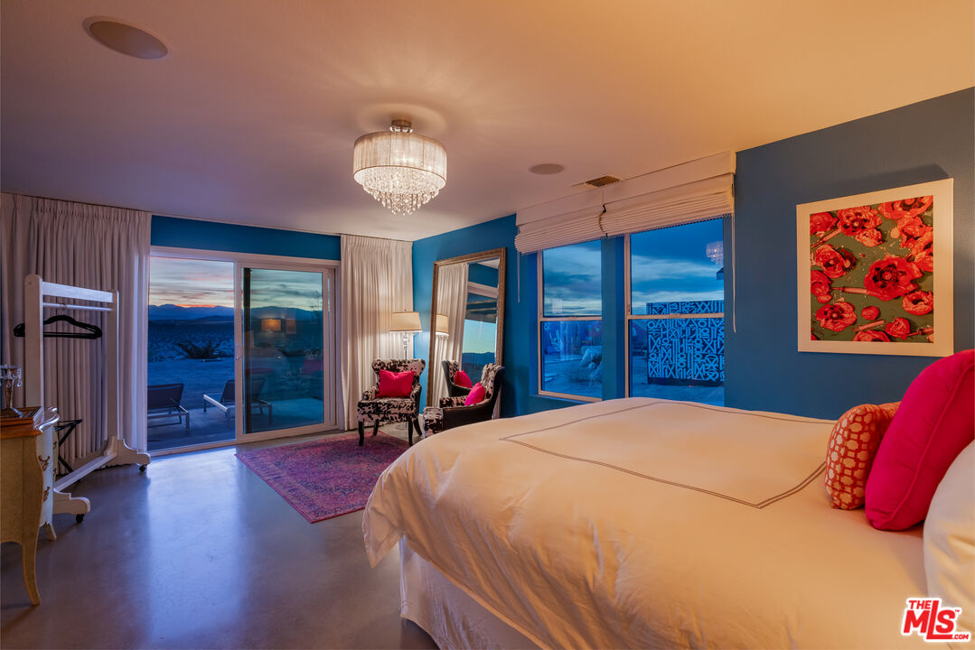 64425 Carot Road Joshua Tree, CA 92252 - Photo 61 of 73 a bed room with a bed and a large window