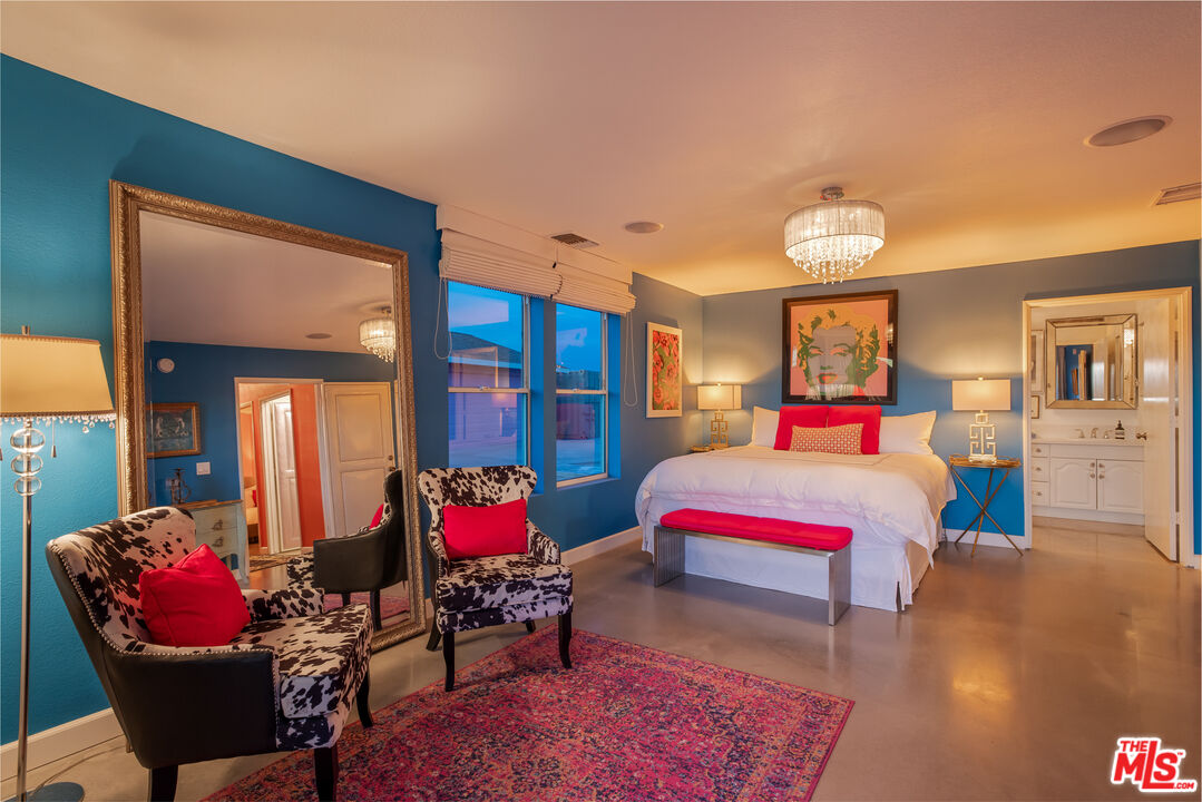 64425 Carot Road Joshua Tree, CA 92252 - Photo 62 of 73 a bedroom with furniture and a potted plant