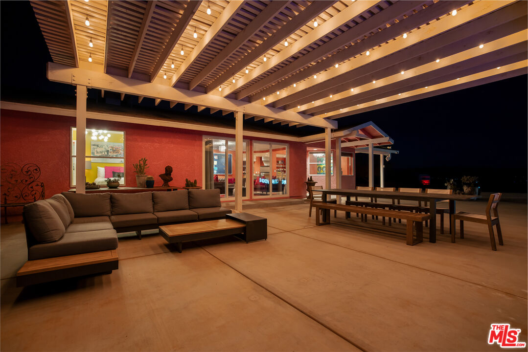 64425 Carot Road Joshua Tree, CA 92252 - Photo 72 of 73 a living room with furniture and a flat screen tv