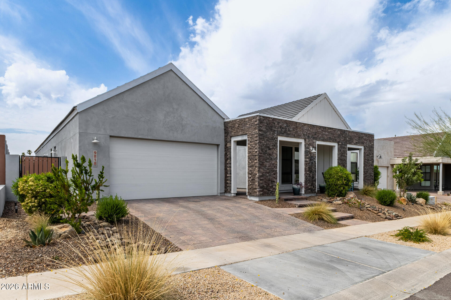 9818 South 7th Place Phoenix, AZ 85042 - Photo 18 of 62 a front view of house with yard and trees in the background