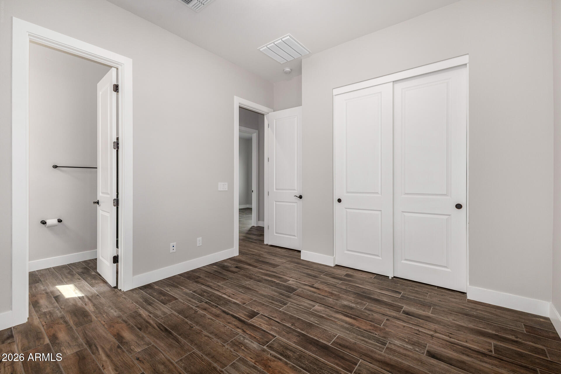 9818 South 7th Place Phoenix, AZ 85042 - Photo 30 of 62 a view of hallway with wooden floor