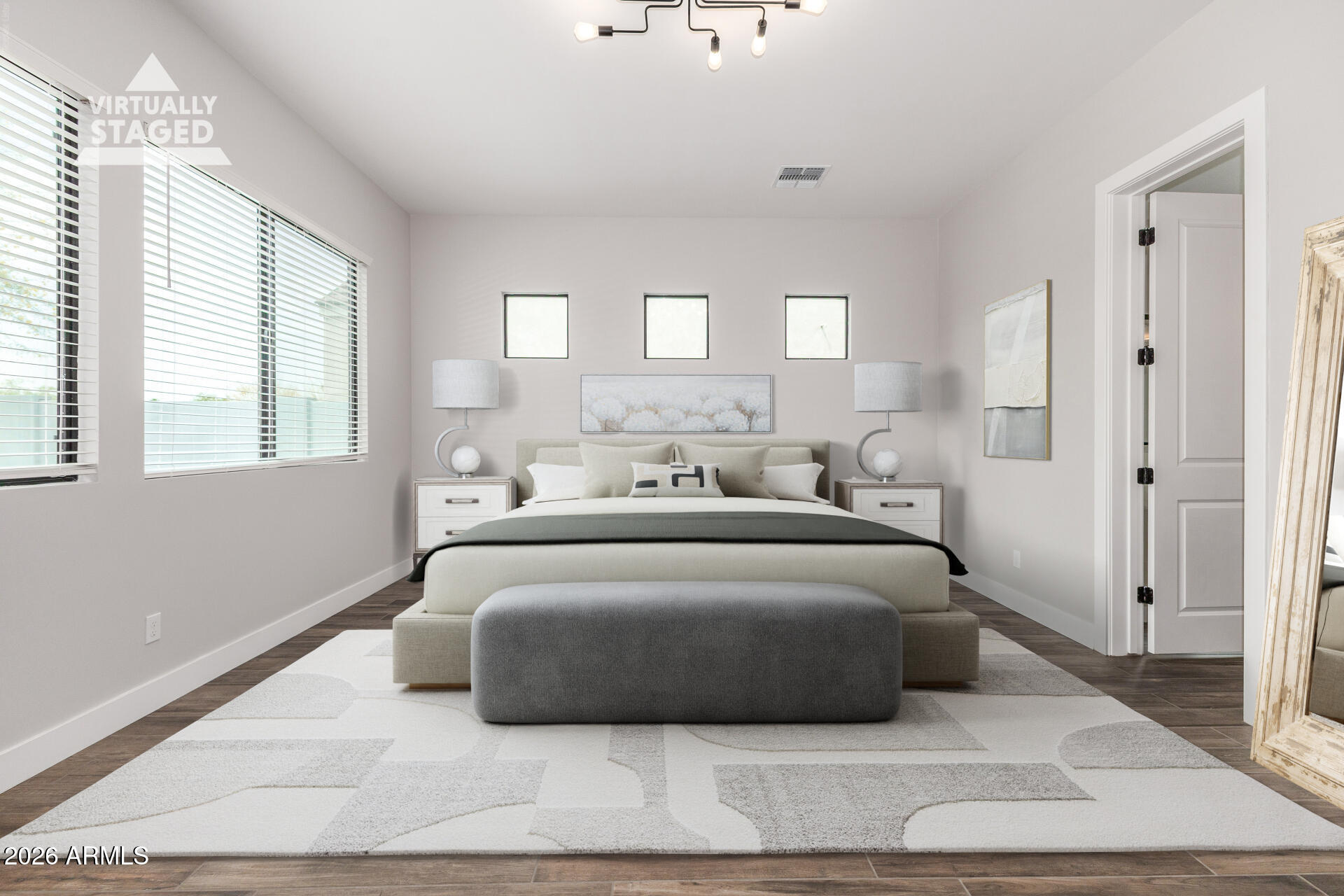 9818 South 7th Place Phoenix, AZ 85042 - Photo 3 of 62 a spacious bedroom with a bed a window and walk in closet