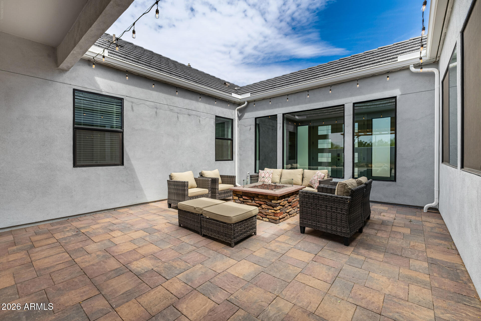 9818 South 7th Place Phoenix, AZ 85042 - Photo 37 of 62 a living room with couches and furniture with floor to ceiling window