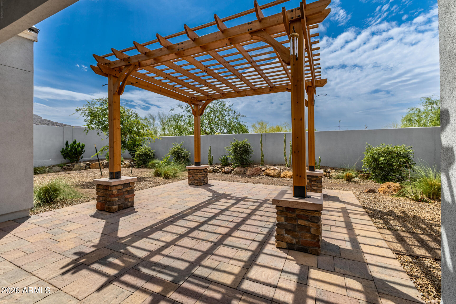 9818 South 7th Place Phoenix, AZ 85042 - Photo 39 of 62 a view of a patio with table and chairs potted plants with wooden floor