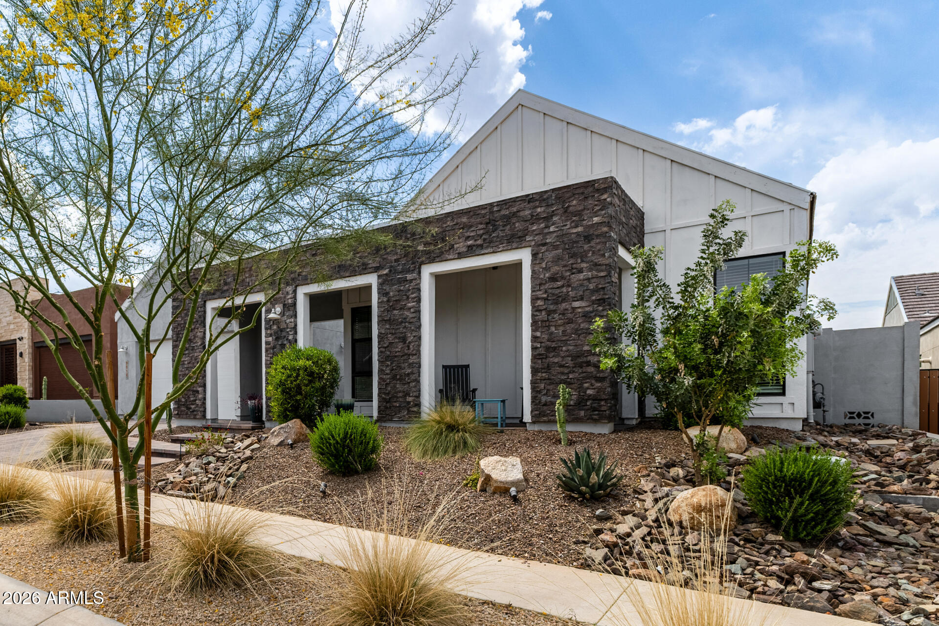 9818 South 7th Place Phoenix, AZ 85042 - Photo 4 of 62 a view of a house with backyard and sitting area