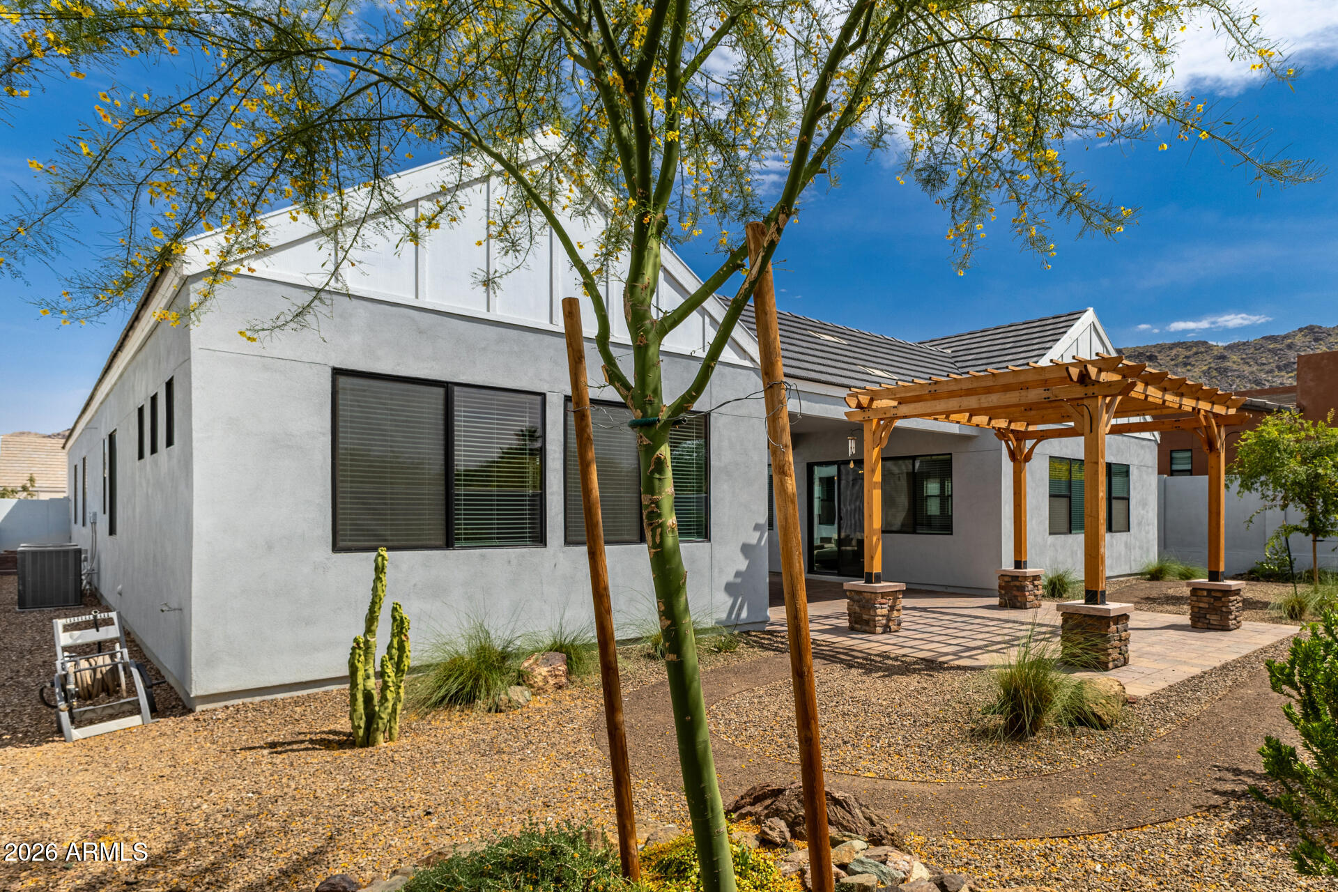 9818 South 7th Place Phoenix, AZ 85042 - Photo 42 of 62 a view of a house with backyard and sitting area