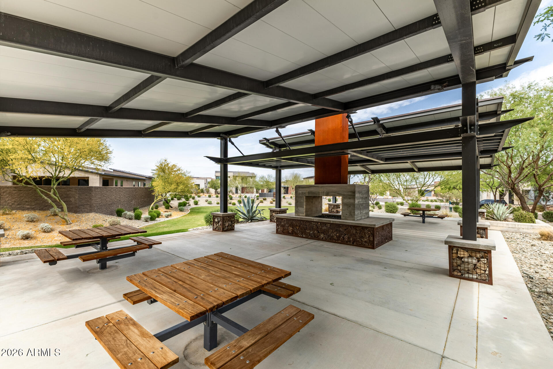9818 South 7th Place Phoenix, AZ 85042 - Photo 45 of 62 a living room with patio furniture and a wooden floor