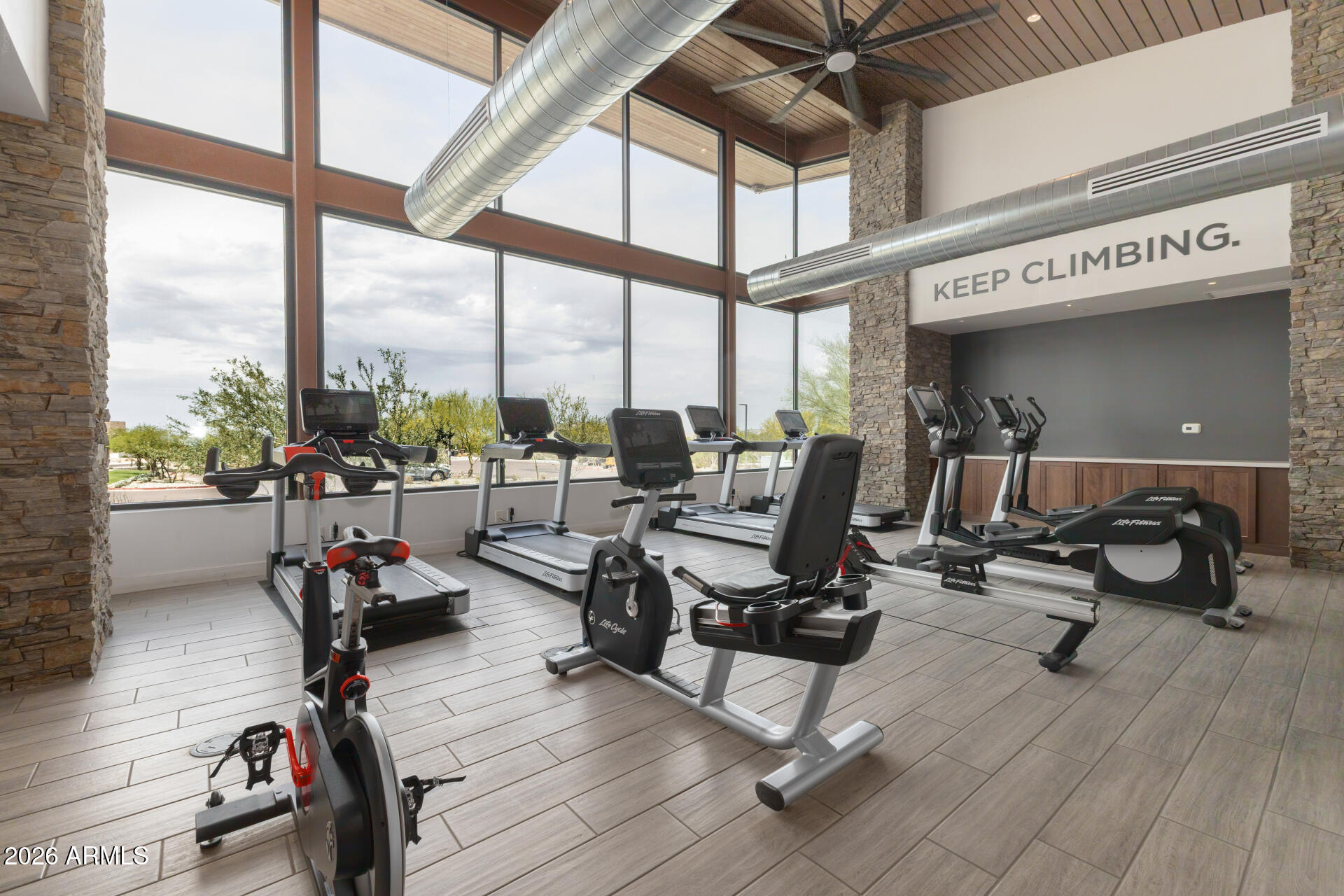 9818 South 7th Place Phoenix, AZ 85042 - Photo 48 of 62 a gym with natural light