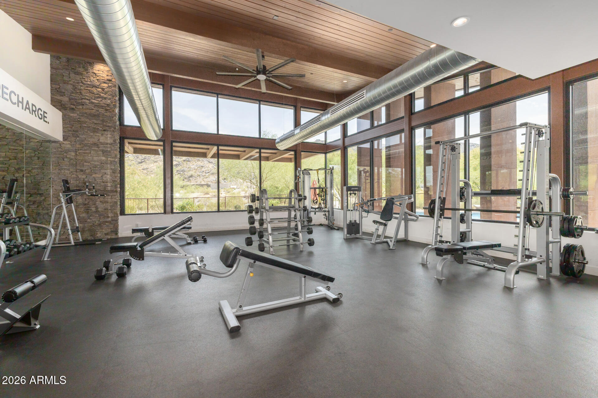 9818 South 7th Place Phoenix, AZ 85042 - Photo 49 of 62 a view of a room with gym equipment and floor to ceiling window