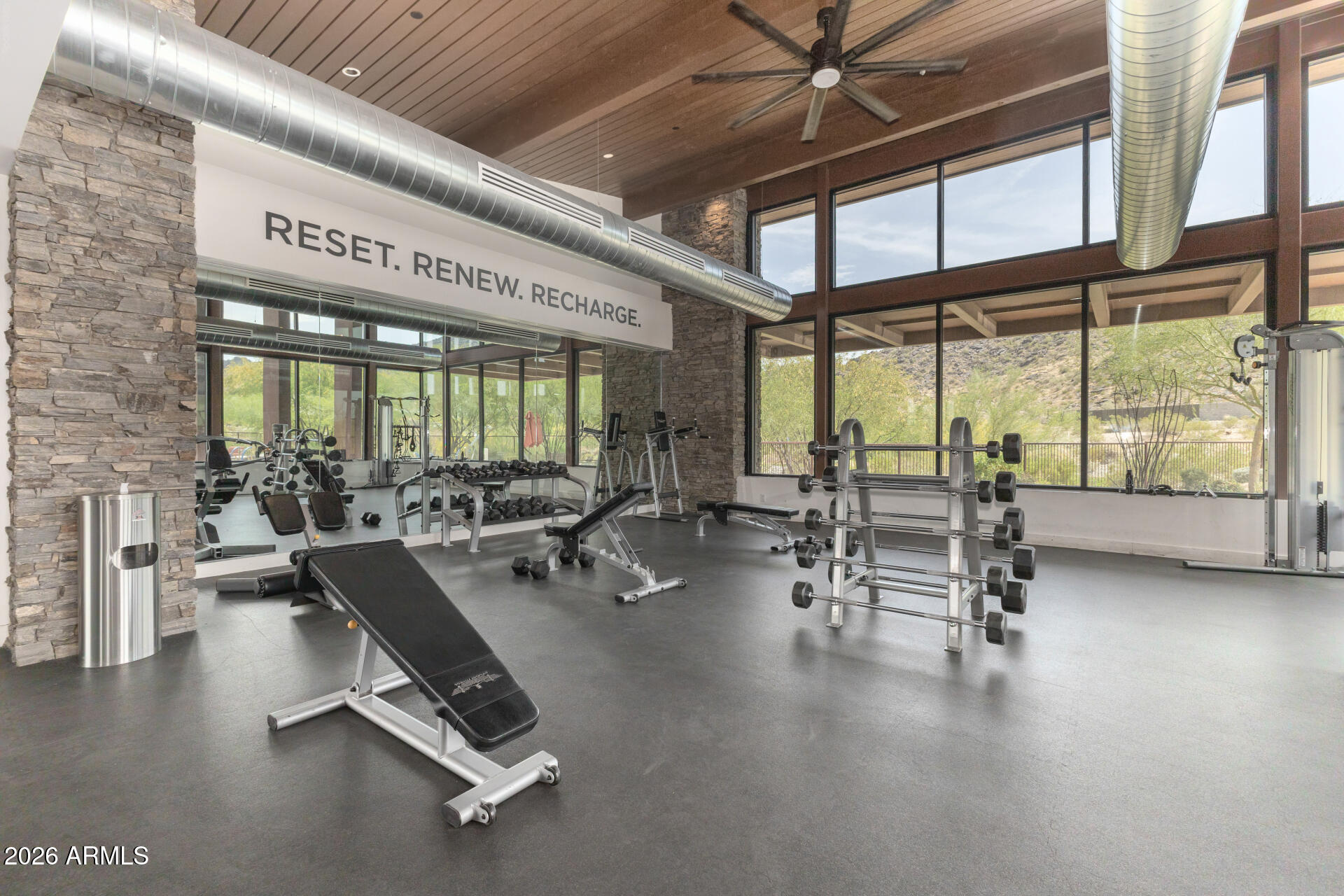 9818 South 7th Place Phoenix, AZ 85042 - Photo 50 of 62 a room with lots of table chair and a large window