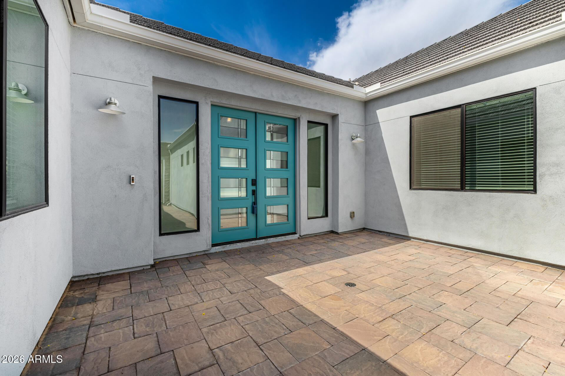 9818 South 7th Place Phoenix, AZ 85042 - Photo 5 of 62 a view of a brick house with a large window