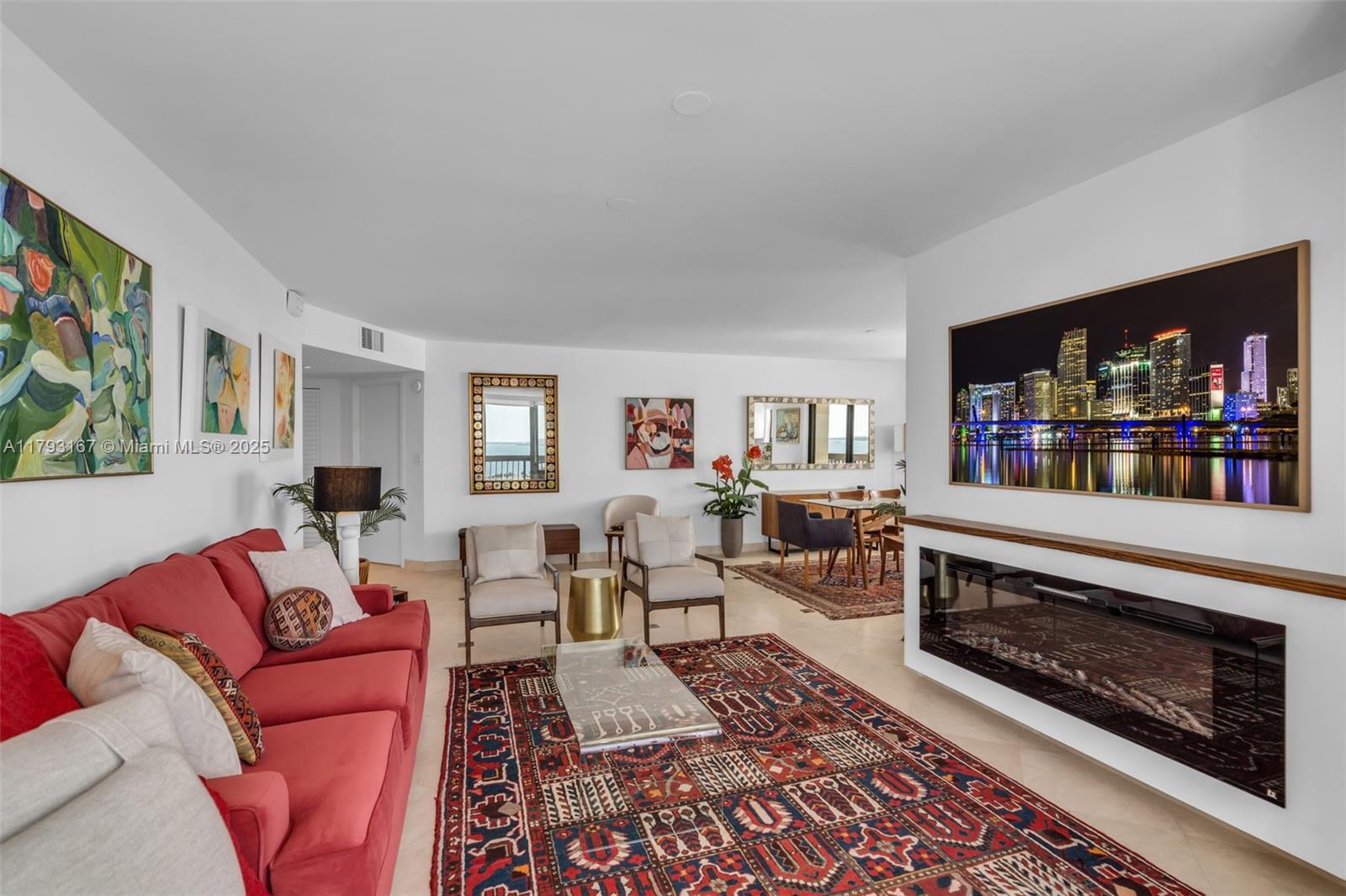 2333 Brickell Avenue, Unit 1401 Miami, FL 33129 - Photo 12 of 36 a living room with furniture and a fireplace