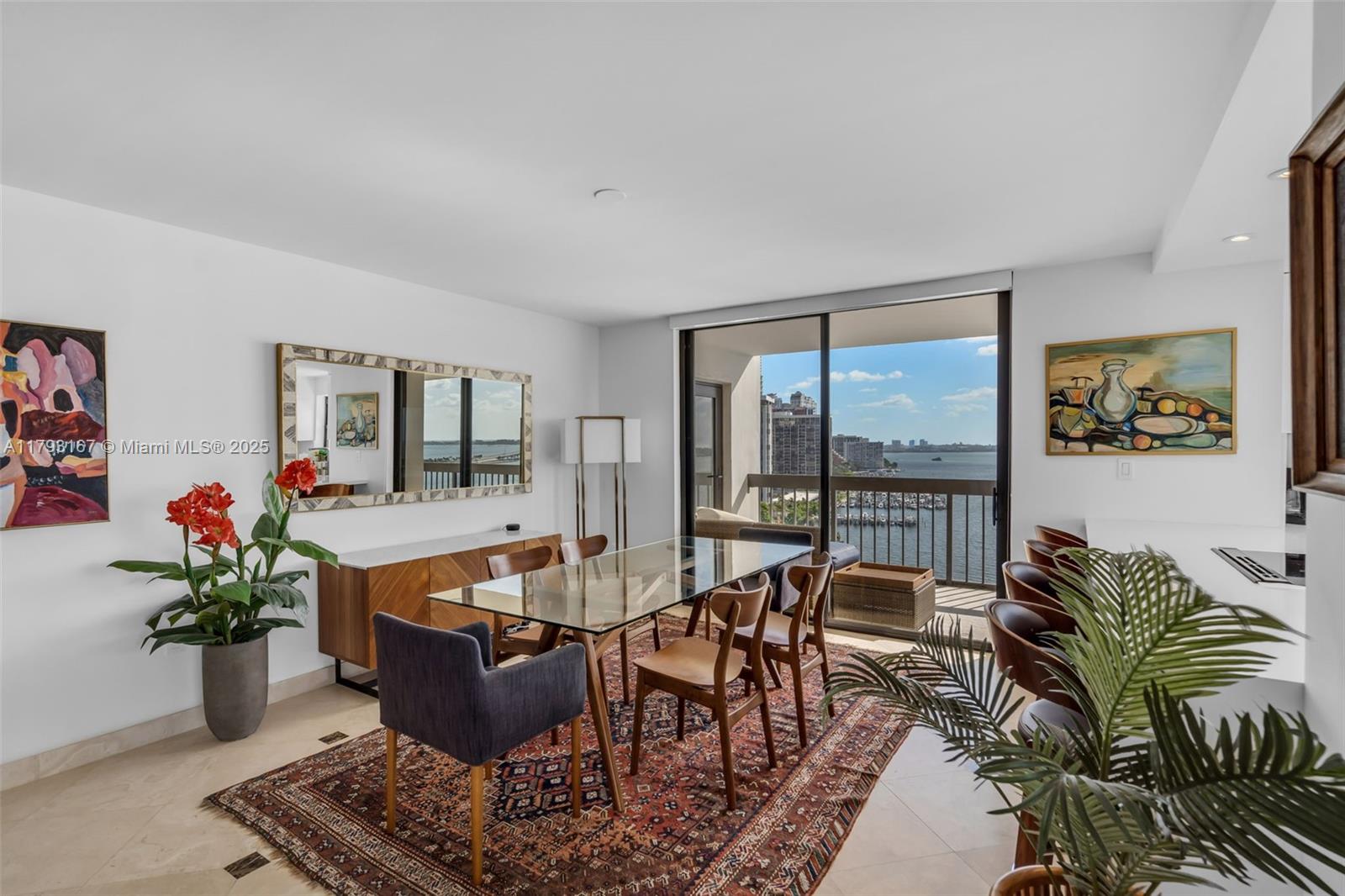 2333 Brickell Avenue, Unit 1401 Miami, FL 33129 - Photo 13 of 36 a living room with furniture and a potted plant