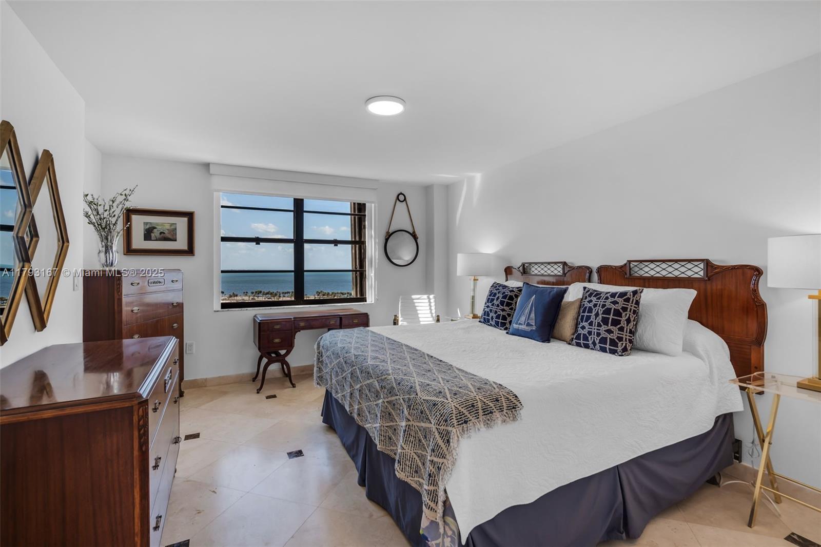 2333 Brickell Avenue, Unit 1401 Miami, FL 33129 - Photo 14 of 36 a bedroom with a bed and a flat screen tv