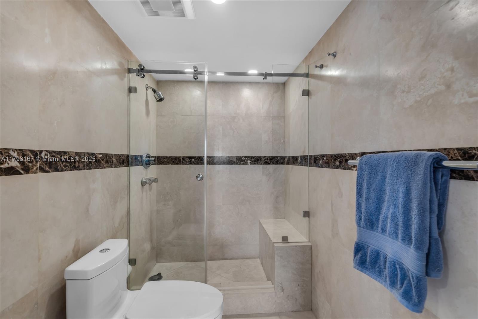 2333 Brickell Avenue, Unit 1401 Miami, FL 33129 - Photo 18 of 36 a bathroom with a toilet and a shower