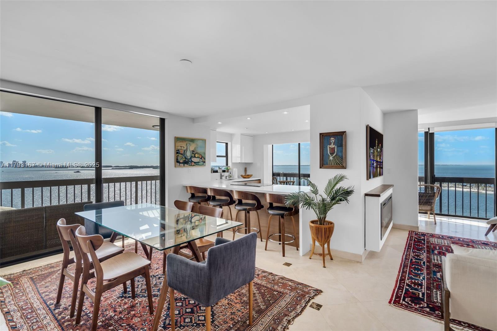 2333 Brickell Avenue, Unit 1401 Miami, FL 33129 - Photo 2 of 36 a living room with furniture and a table