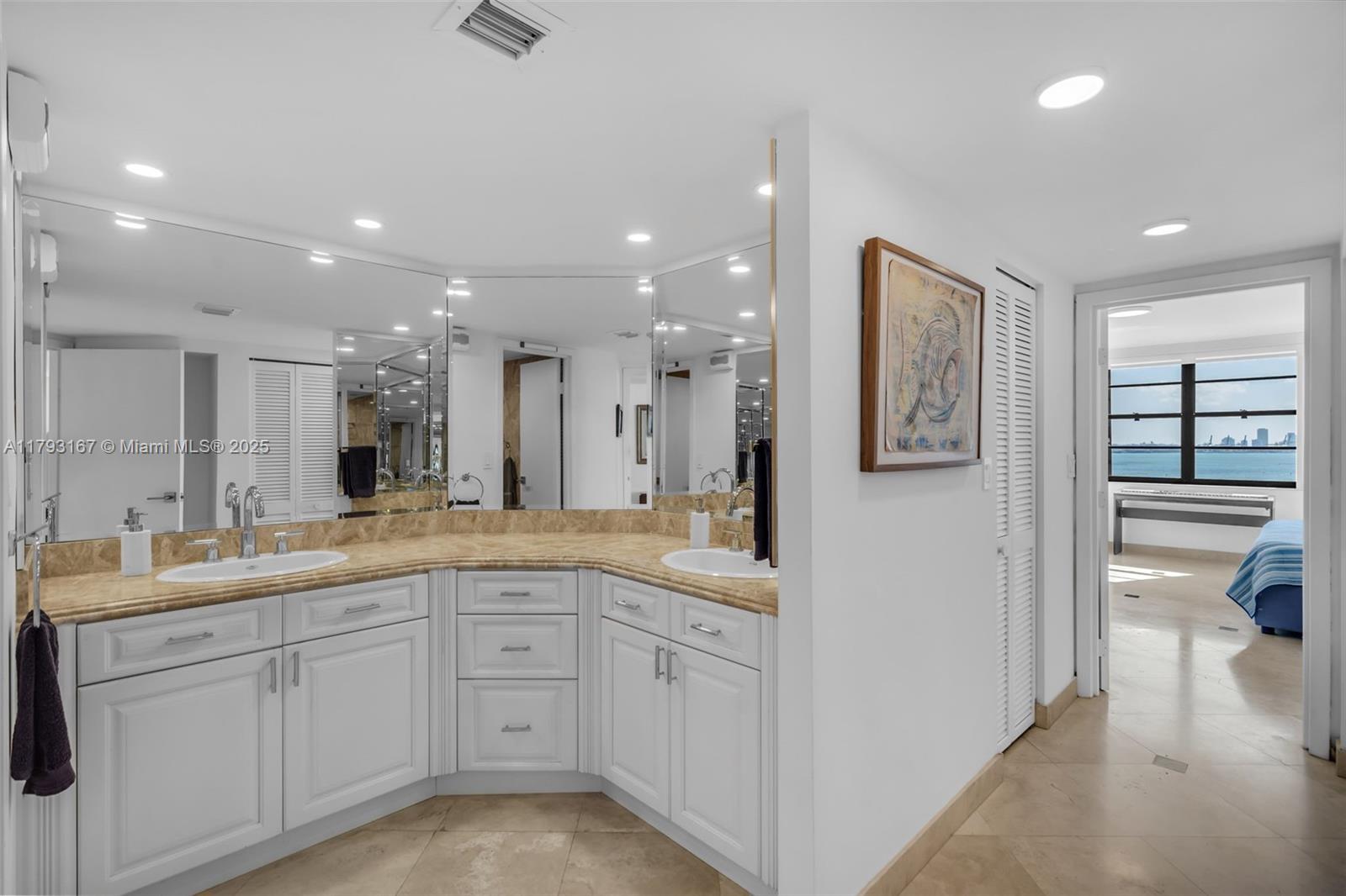 2333 Brickell Avenue, Unit 1401 Miami, FL 33129 - Photo 21 of 36 a large white bathroom with a granite countertop sink