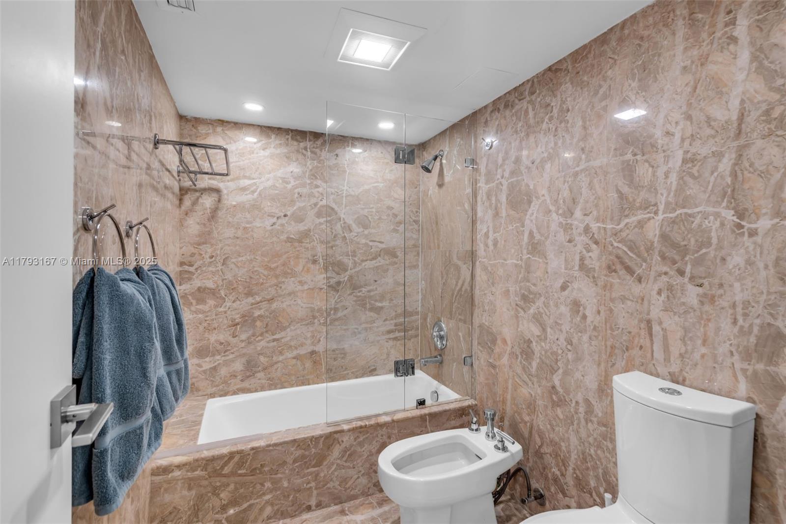 2333 Brickell Avenue, Unit 1401 Miami, FL 33129 - Photo 23 of 36 a bathroom with a toilet and a shower