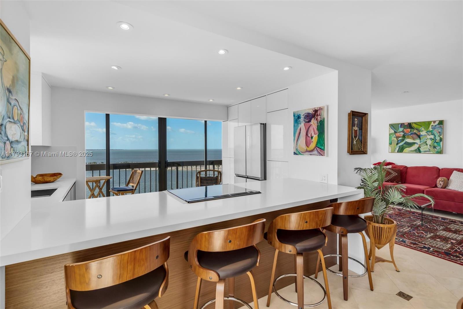 2333 Brickell Avenue, Unit 1401 Miami, FL 33129 - Photo 3 of 36 a hallway with dining table and chairs