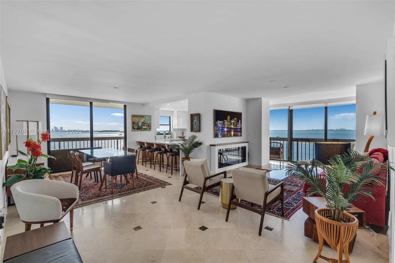2333 Brickell Avenue, Unit 1401 Miami, FL 33129 - Photo 5 of 36 a living room with furniture potted plant and a large window