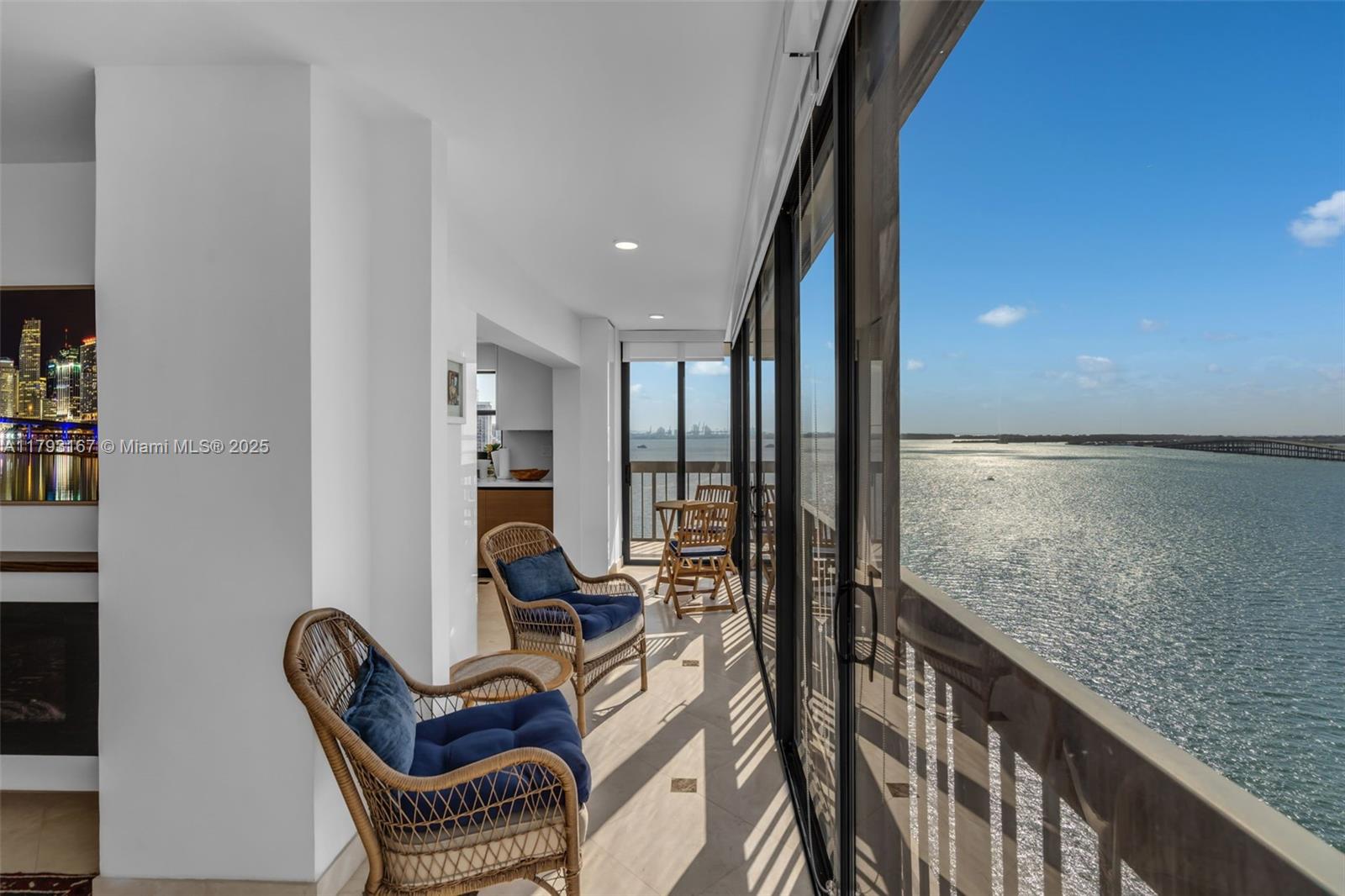 2333 Brickell Avenue, Unit 1401 Miami, FL 33129 - Photo 10 of 36 a view of living room with furniture and floor to ceiling window