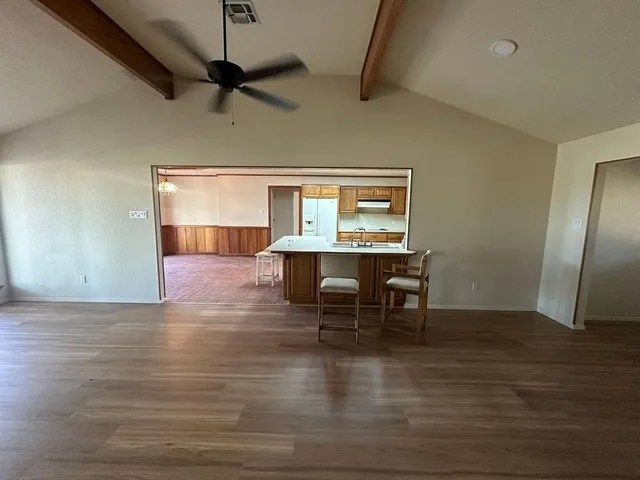 a view of a dining room with furniture and a table