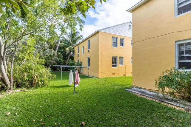 a house view with a backyard space