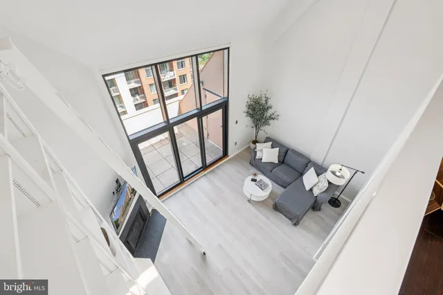 a view of living room with furniture and a window