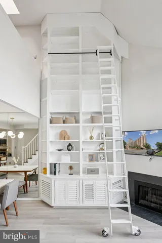 a view of a livingroom with furniture and staircase