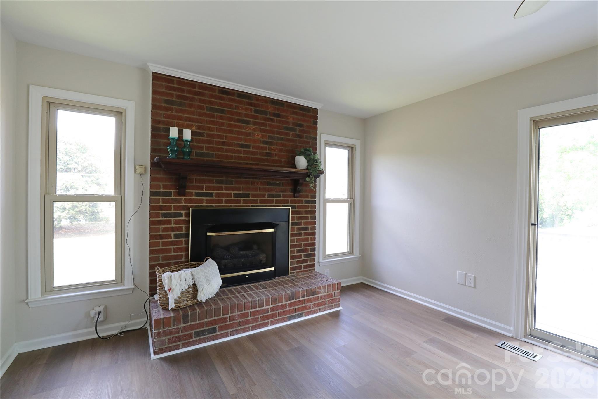 12809 Pine Bluff Road Midland, NC 28107 - Photo 15 of 41 a living room with a fireplace
