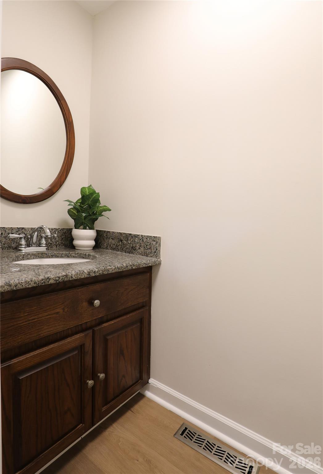 12809 Pine Bluff Road Midland, NC 28107 - Photo 16 of 41 a bathroom with a granite countertop sink and a mirror