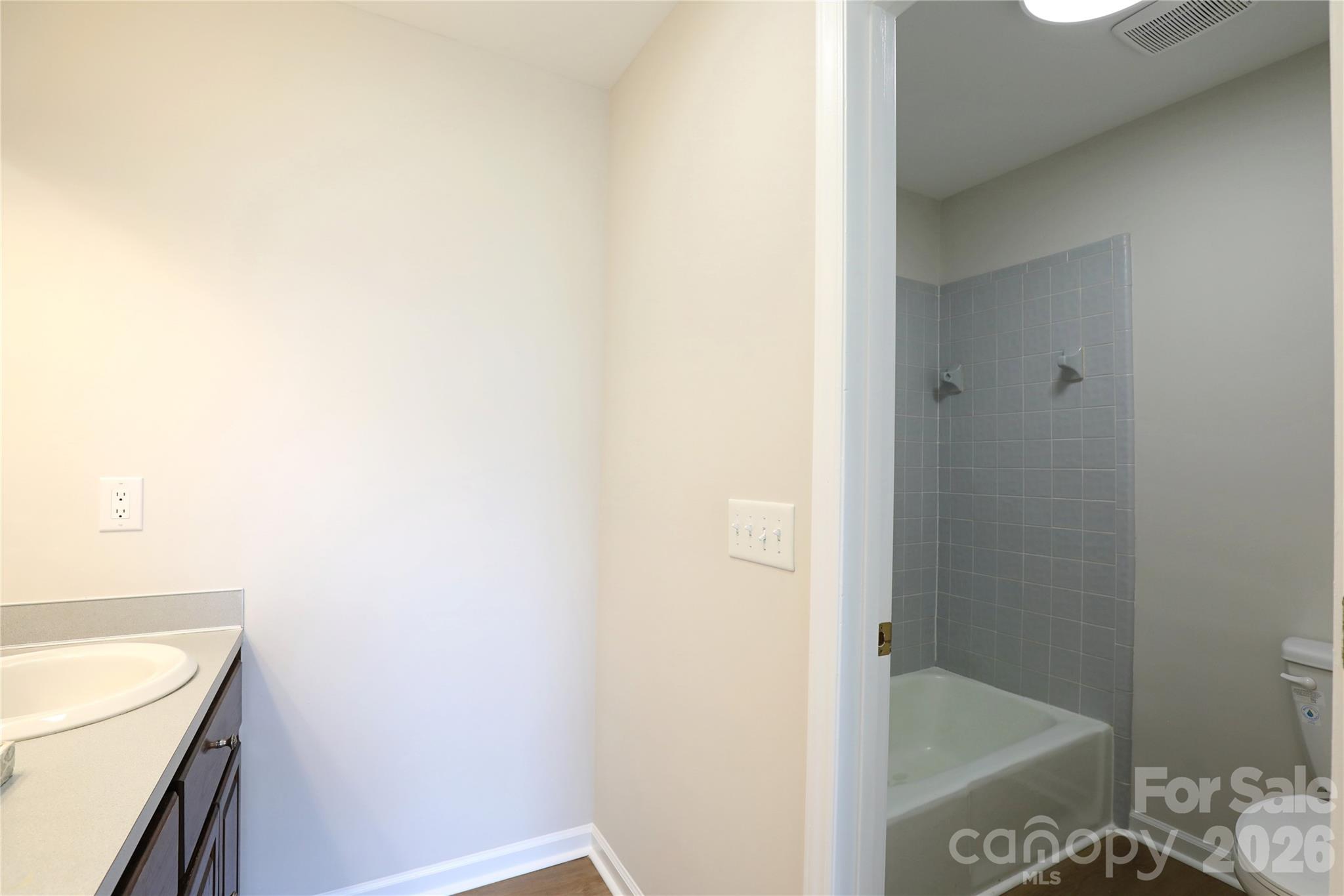 12809 Pine Bluff Road Midland, NC 28107 - Photo 21 of 41 a bathroom with a shower and a sink
