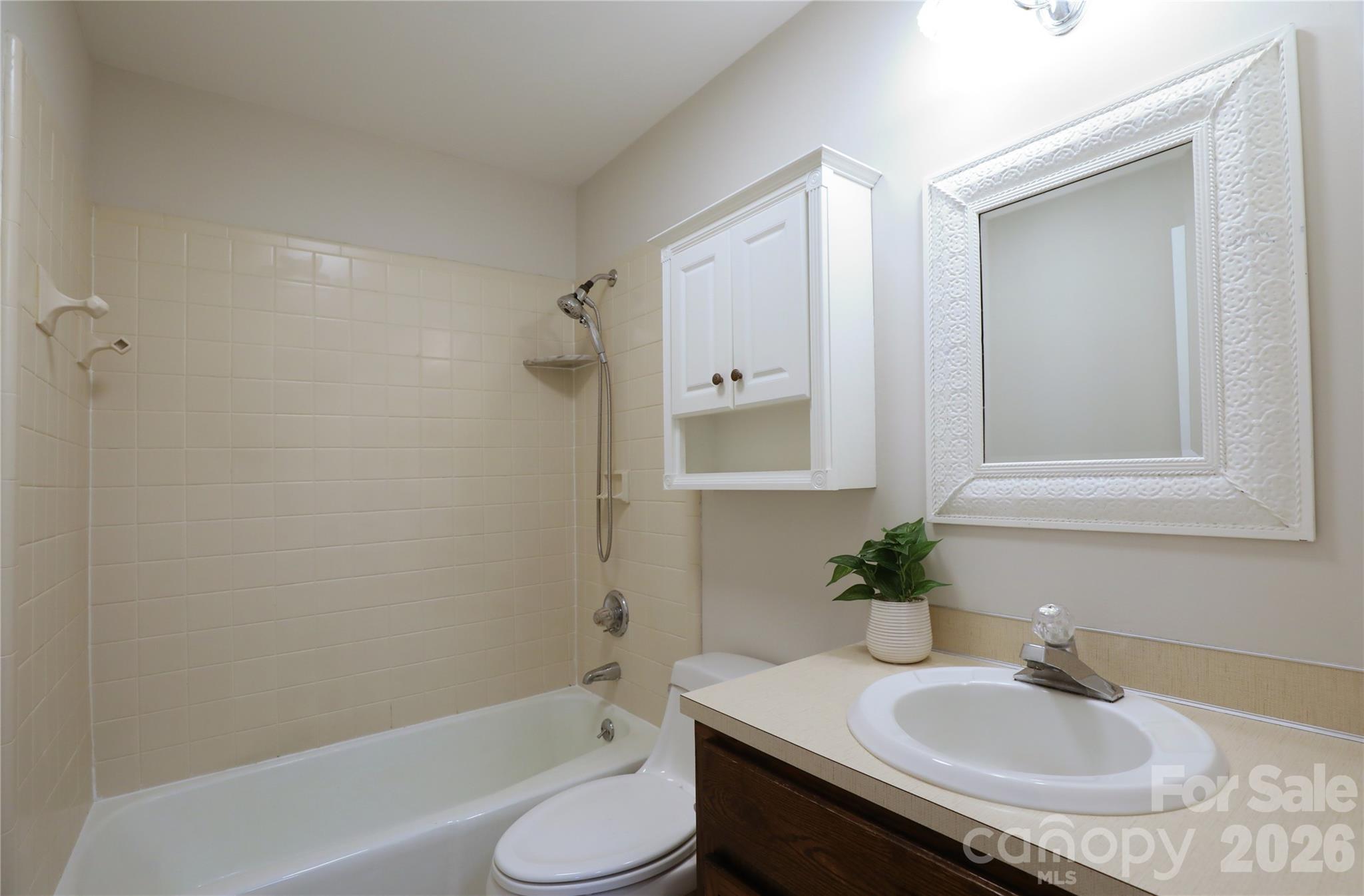 12809 Pine Bluff Road Midland, NC 28107 - Photo 27 of 41 a bathroom with a sink toilet and shower
