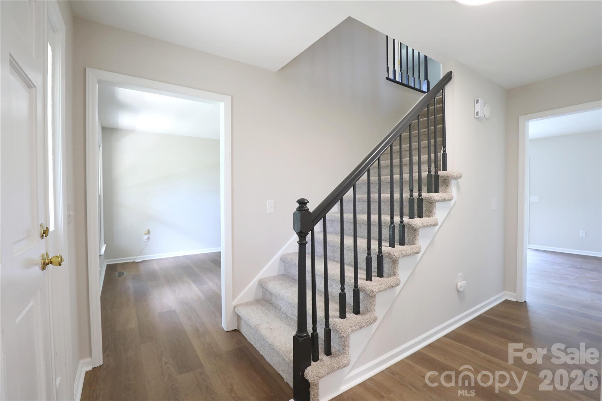 12809 Pine Bluff Road Midland, NC 28107 - Photo 3 of 41 a view of a hallway with wooden floor and entryway